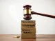 A federal court gavel strikes down California's ammunition background checks, symbolizing the overturning of the controversial gun control law.