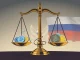 Department of Justice scales of justice weighing crypto assets, symbolizing the ongoing fight against crypto laundering and financial crime.