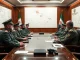 Iranian military officials discussing response to Israeli aggression in a high-security meeting