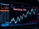 Nasdaq-100 index reaching a record high on a digital stock market dashboard