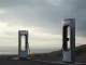 A desolate EV charging station in California symbolizes Tesla's declining EV sales and market challenges.