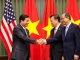 Trump and Vietnamese officials shaking hands to finalize the trade deal