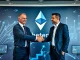 Joseph Chalom, former BlackRock executive, shaking hands to signify his new role as co-CEO at SharpLink Gaming, boosting Ethereum growth.
