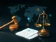 A judge's gavel and global map symbolizing the FTX liquidation breakthrough, allowing cross-border claims for creditors.