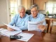 Elderly couple reviewing Social Security benefits to maximize retirement income