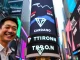 Justin Sun ringing the Nasdaq bell, symbolizing TRON's market cap rise over ADA.