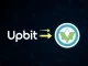 Upbit and Mantra (OM) logos signifying the updated token circulation plan on the Upbit crypto exchange platform.
