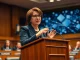 Senator Amy Klobuchar advocating for stronger US crypto regulation and consumer protection in a legislative hearing.