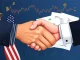 U.S.-South Korea trade deal signing with cryptocurrency charts in the background