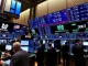 U.S. stock markets trading floor with mixed results for major indices
