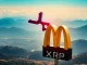 An XRP market cap chart visually surpassing McDonald's iconic golden arches, symbolizing a significant financial milestone for digital assets.