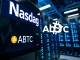 American Bitcoin (ABTC) stock symbol on a Nasdaq ticker, representing its powerful debut and Trump-backed Bitcoin mining success.