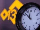 A clock indicating a delay in the Binance FF perpetual futures listing, affecting crypto derivatives traders.