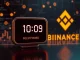 A digital clock face indicating a delay, symbolizing the postponement of the Binance XAN perpetual futures listing.