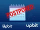 Upbit 0G listing postponed, symbolizing delays in crypto exchange operations due to blockchain network instability.