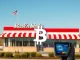 Steak 'n Shake restaurant with a digital display showing the Bitcoin logo, symbolizing their decision to hold all customer **Bitcoin payments** in corporate reserves.