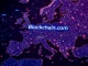 Blockchain.com MiCA license certificate being held against a backdrop of a European map, symbolizing its expansion into EEA crypto services.