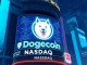 Conceptual image showing the Dogecoin logo on a Nasdaq stock ticker, representing the **Dogecoin Nasdaq listing** through the House of Doge merger.