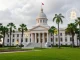 Florida Bitcoin Investment bill represented by state capital building and crypto symbols, symbolizing state crypto policy.