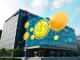 Lib Work's strategic $3.3M Bitcoin purchase represented by a Japanese corporate building integrating Bitcoin symbols into its financial strategy.