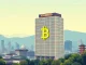 Remixpoint's strategic Bitcoin investment displayed through a digital chart with a Japanese corporate building background.