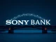 Sony Bank's logo superimposed on a digital currency symbol, representing their pursuit of a US stablecoin regulation charter and entry into digital asset banking.