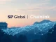S&P Global and Chainlink logos intertwined, symbolizing their partnership to bring stablecoin assessment data on-chain.