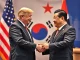 US and China leaders shaking hands at a summit, symbolizing critical US-China trade talks and diplomatic efforts in South Korea.