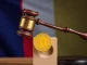 A gavel and French flag symbolizing the passage of the France crypto tax bill, impacting cryptocurrency holdings and digital assets.