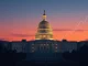 US Capitol Building illuminated at night, symbolizing the end of a **government shutdown** and the return of stability after a congressional agreement.