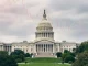 The US Capitol building under a dramatic sky, symbolizing the crucial US government shutdown vote and its potential impact on market stability.