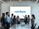 Business team reviewing Coinbase custom stablecoin service interface for issuing company digital currency.