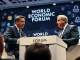 Coinbase CEO and Bank of France Governor debate stablecoin interest payments at the World Economic Forum in Davos.