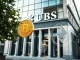 UBS bank building with digital crypto symbols representing its new trading services for private clients.