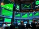 US stocks market rally showing S&P 500, Nasdaq, and Dow Jones gains on trading floor displays