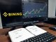 Binance cross margin trading interface showing new PAXG, ASTER, SUI, and XRP pairs on a professional trading desk.