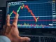 Bitcoin chart showing sharp rejection at $72K as traders face critical decisions.