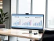 Analyst comparing online gambling revenue models including 33% CashRake system on digital charts