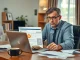Person reviewing new IRS 1099-DA crypto tax form on laptop with concern