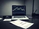 Brian Armstrong Coinbase CEO stock sale of $550 million shown on financial documents and stock chart.