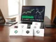 Analyst reviewing crypto presale projects on a laptop with market charts visible