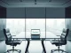 Gemini leadership restructuring meeting room with empty chairs symbolizing executive departures and strategic change.
