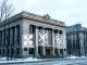 Moscow Exchange building with Solana, XRP, and TRX logos representing new crypto futures launch.