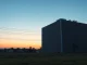 Senator Mark Warner's proposal to tax AI data centers to address worker displacement concerns.