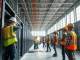 Construction workers building AI data center infrastructure as described by Nvidia CEO Jensen Huang.