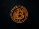 Bitcoin symbol representing challenging market phase with repeated price rejections at $72,000 resistance level