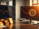 Gold bars and Bitcoin price chart comparison on a financial desk.