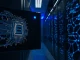 Split image showing a quantum computer chip and AI server rack, representing Bitcoin security and new AI token.