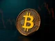 Bitcoin supply in profit metric analysis showing a coin partially in light and shadow, representing market cycle data.
