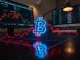 Bitcoin price chart showing a critical trend line showdown with the 200-week exponential moving average.